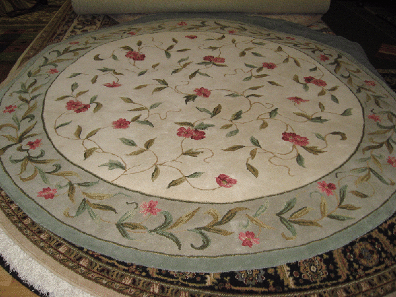 ivoryandgreenroundrug